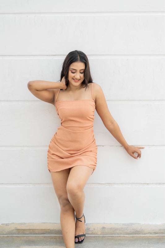 Peach ruched mini dress